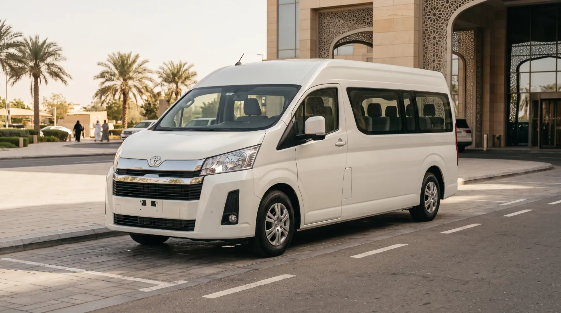 White Toyota HiAce van parked outside a hotel